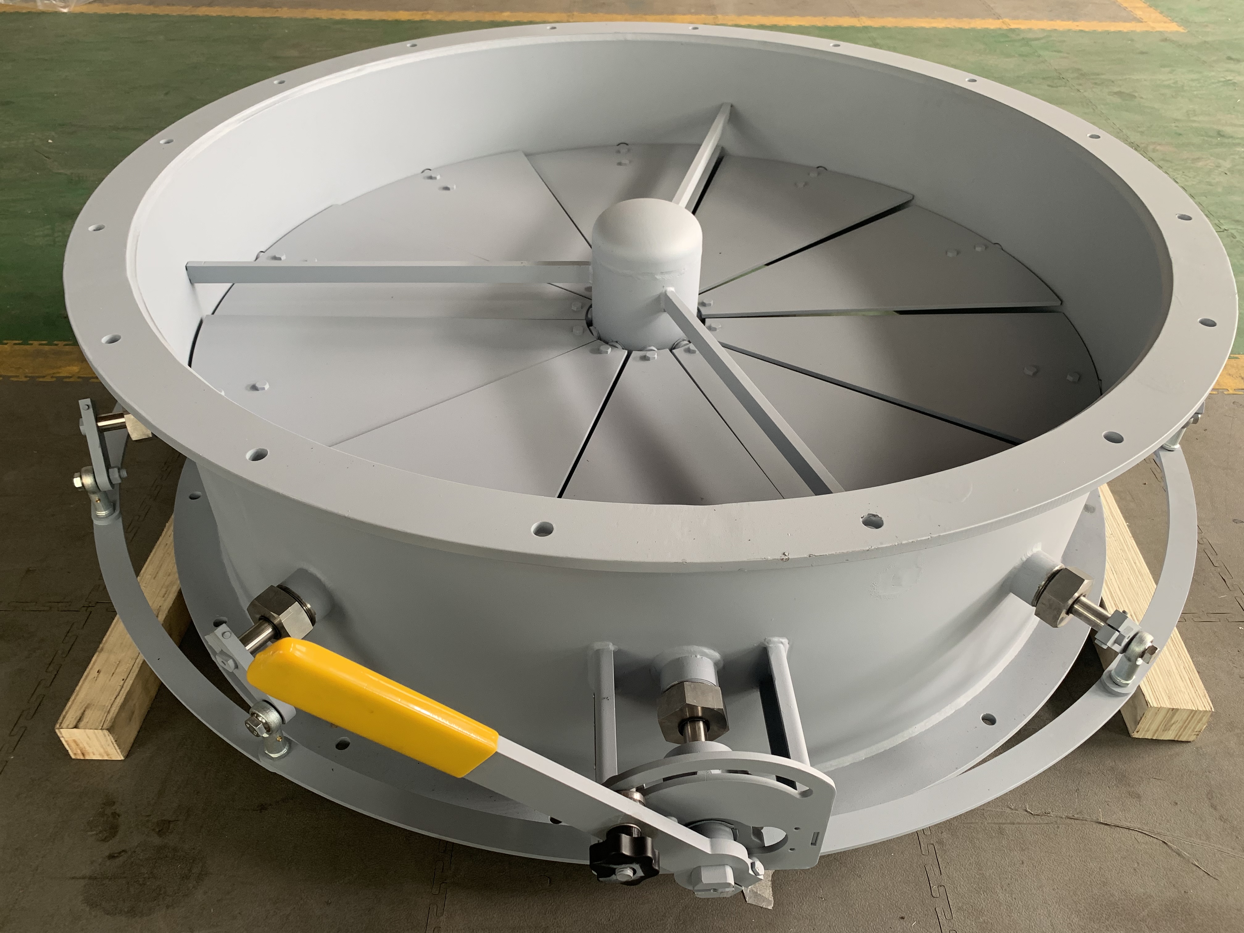 Workshop finished product showing a manual inlet vane control damper with an external linkage manually operated used to adjust the airflow at the inlet of a centrifugal fan