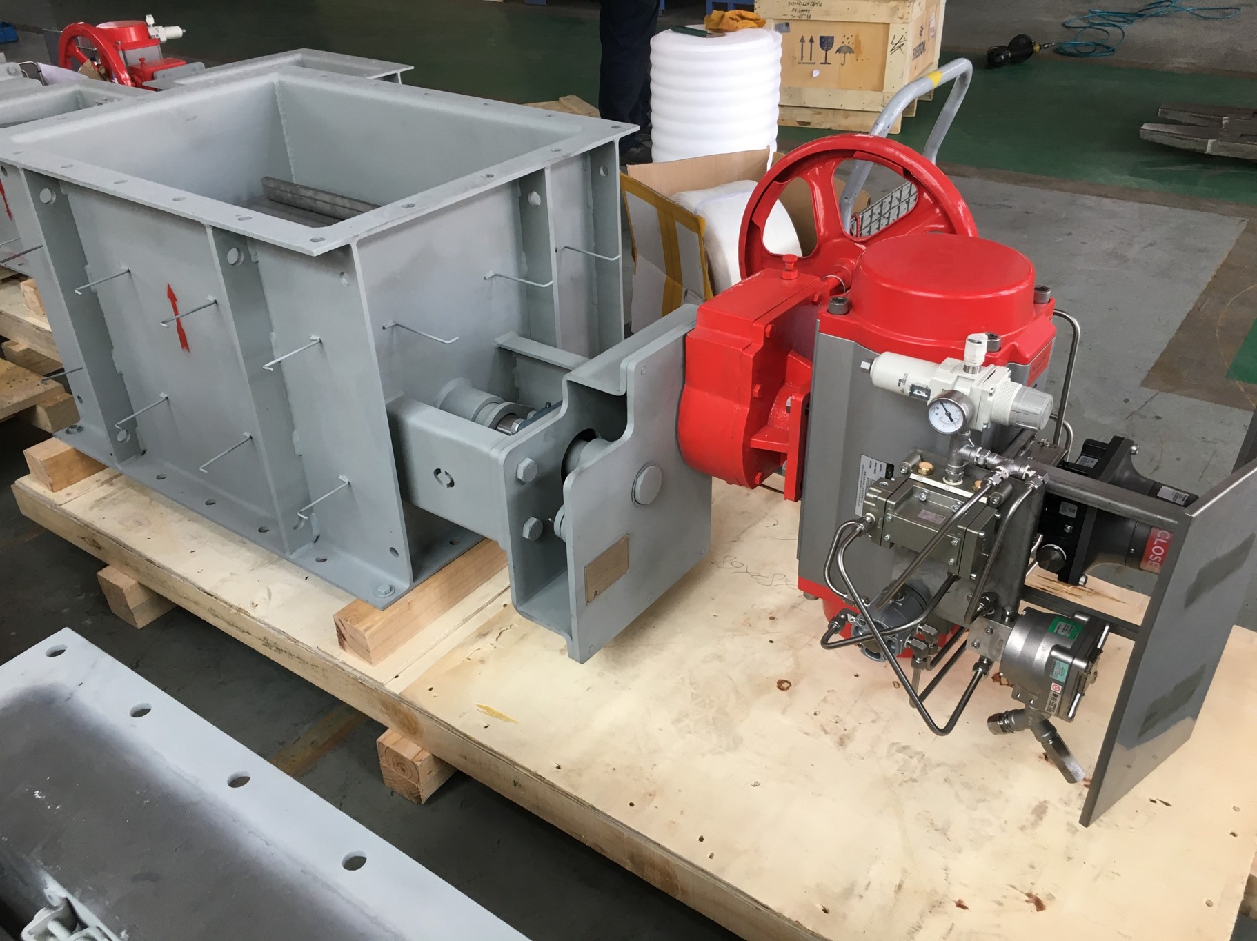 Square pneumatic louver damper with insulated pins finished products placed on wooden pallets in the workshop used for flue gas control in waste incineration flue gas purification systems