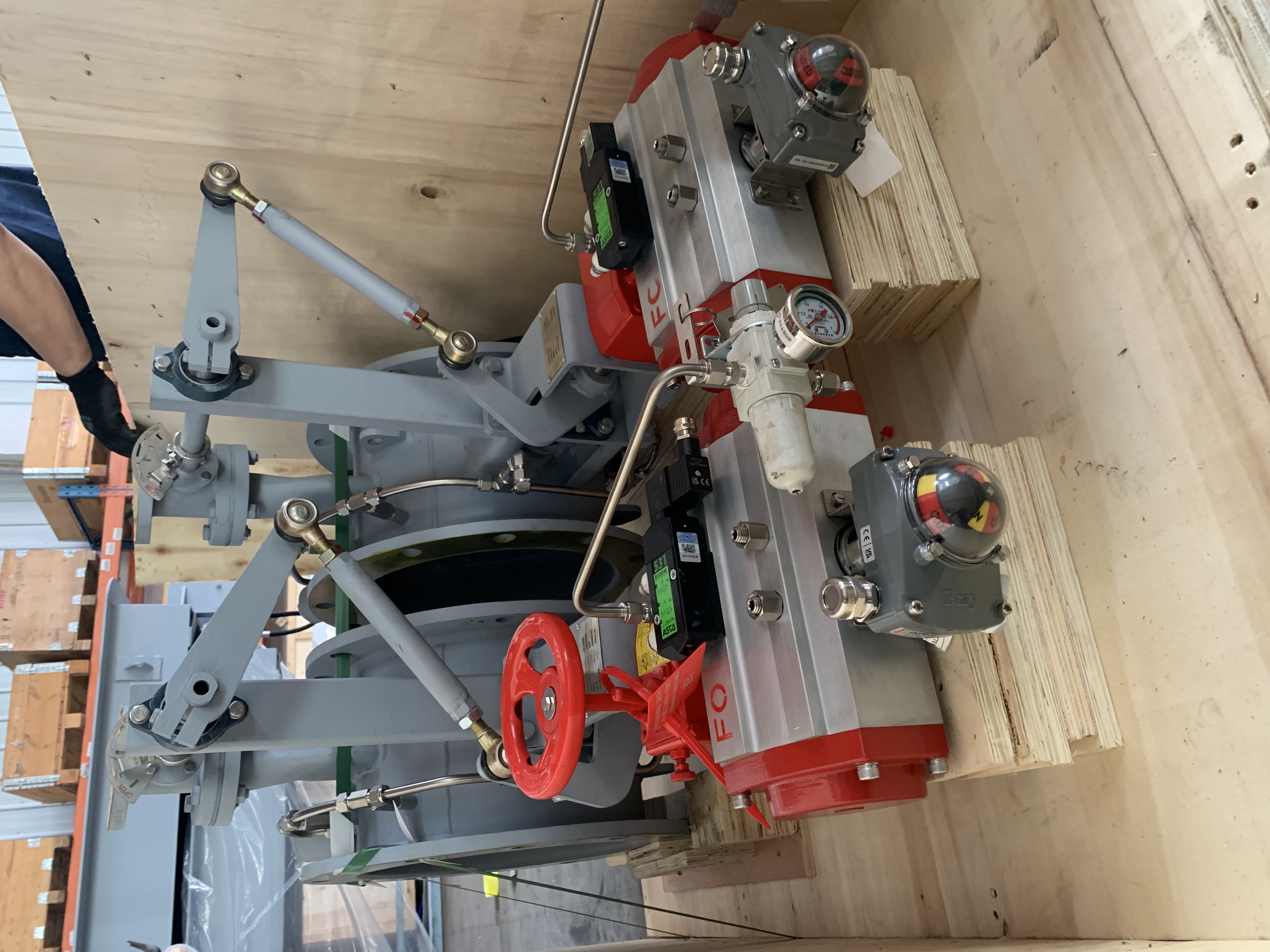 Two pneumatic air sealing isolation butterfly dampers with mechanical linkages and a gas purging system equipped with pneumatic actuators used for the ship exhaust cleaning system